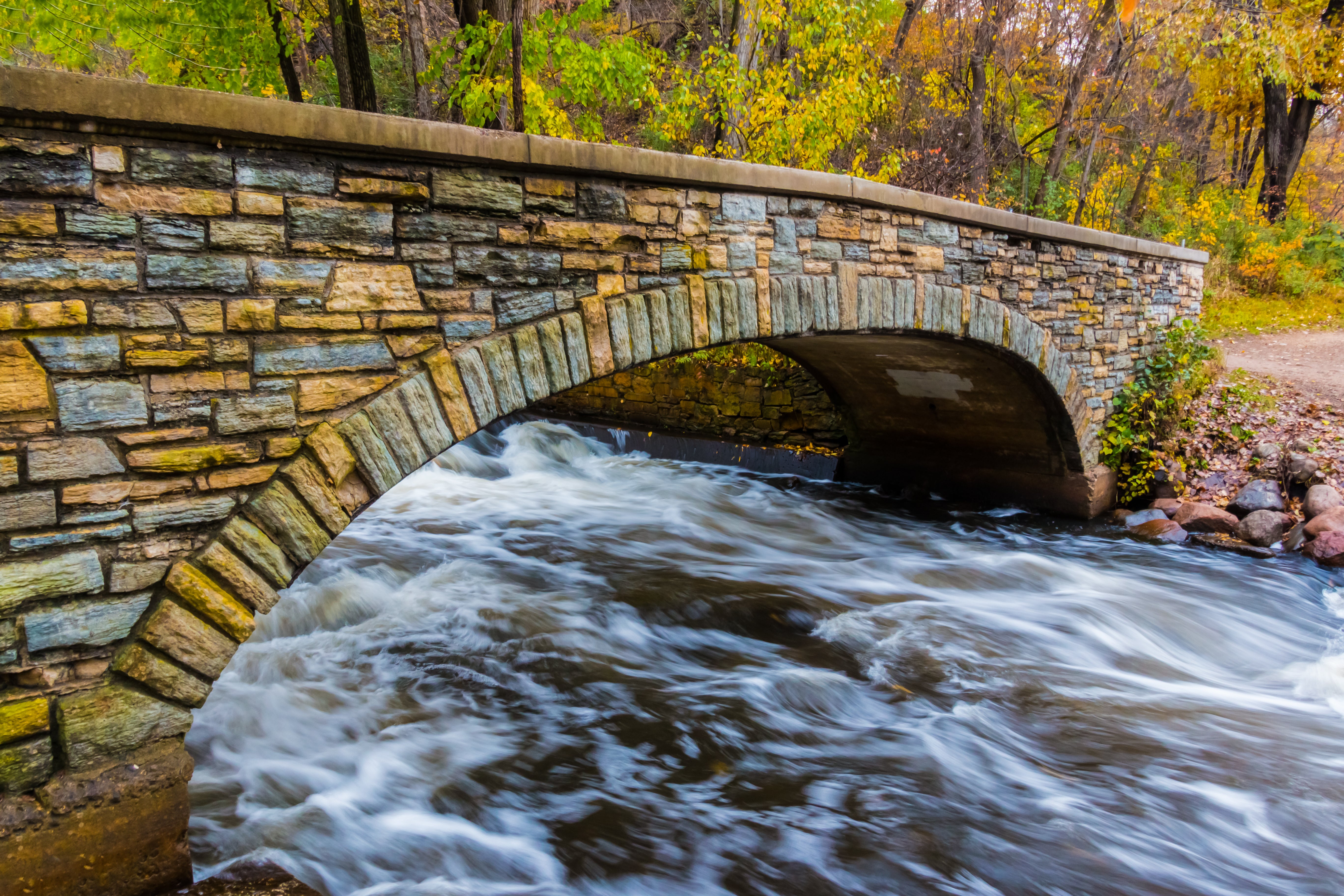 Stone bridge over rippling Minnehaha Creek in Minneapolis